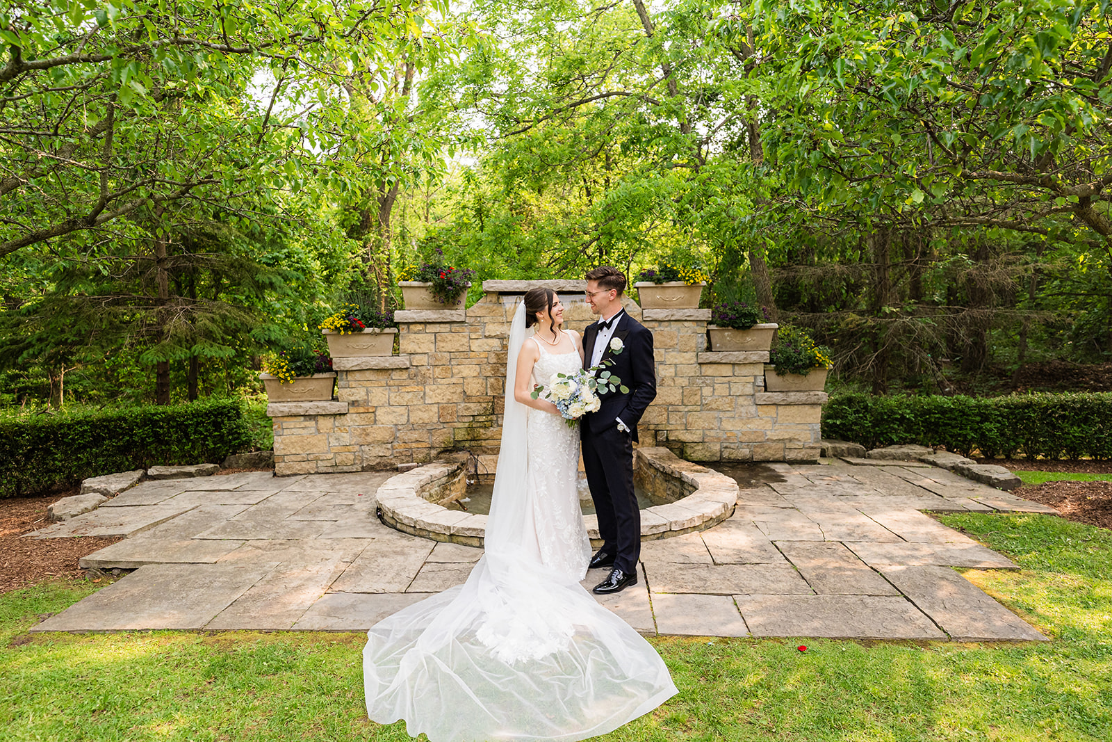 Keanna and Garrett together in a garden on their wedding day