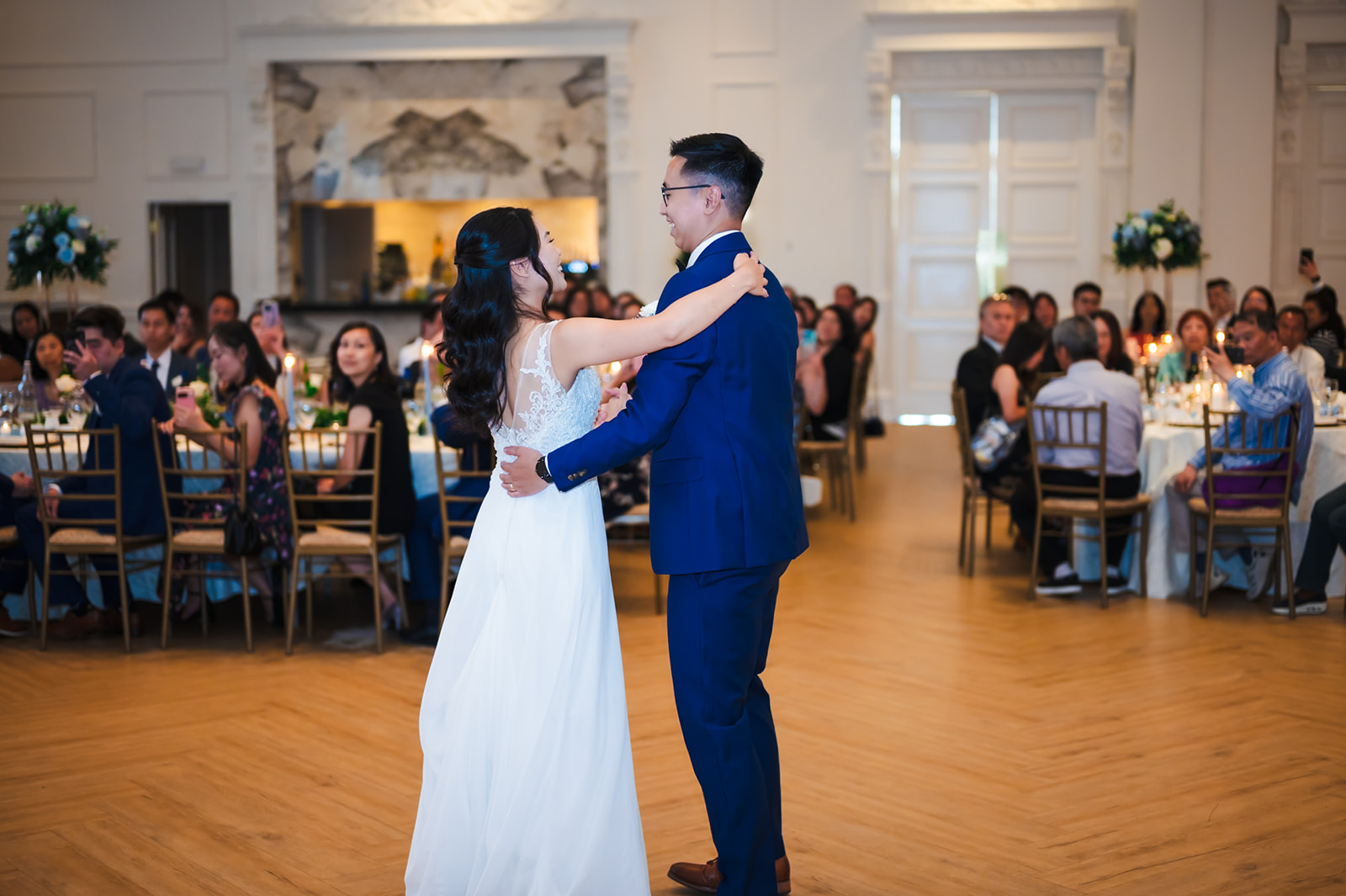 Monica and Andrew's first dance surrounded by seated guests